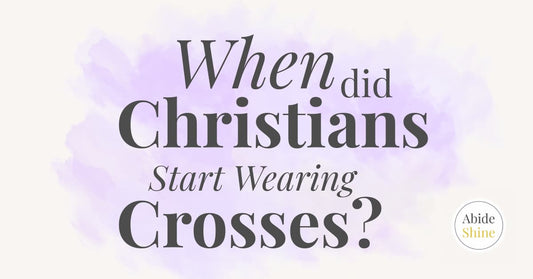 Blog header titled When did Christians start Wearing Crosses? Bold writing with a purple watercolour splash background